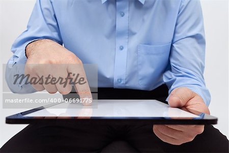 Man working on tablet - closeup on device and hands, with copy space