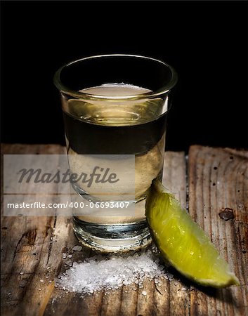 Tequila shot with lime slice and salt