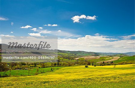 The Medieval Italian Town Surrounded By Forests and Plowed Fields