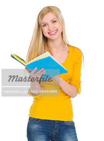 Smiling student girl reading book