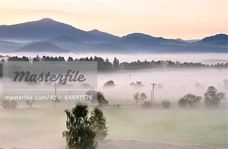 Autumn fog and the beautiful morning sun in a landscape