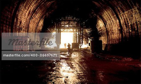 Railway tunnel under construction backlight horizontal warm light