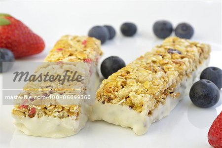 Granola bars with berries on a blurry background
