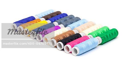 Several Multicolor Spools of Thread on white background