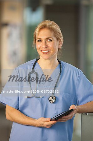 Portrait of a female nurse holding a digital tablet