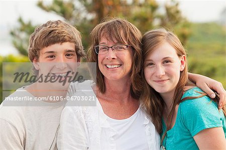 Portrait of a woman smiling with her children, Block Island, Rhode Island, USA