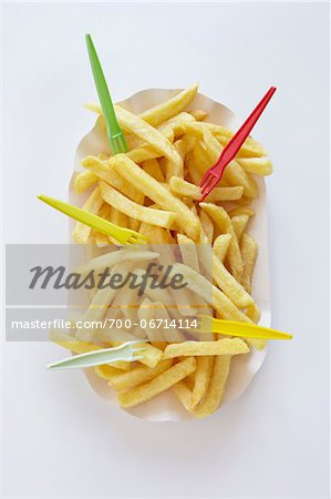 still life of french fries with plastic forks still life of french fries with plastic forks