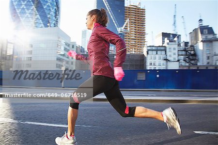 Woman running on city street