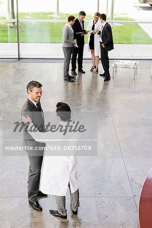 Business people and doctors greeting