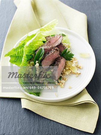 Plate of lamb and grape salad