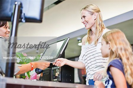 Mother and daughter in grocery store Mother and daughter in grocery store