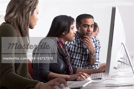 People using computers at desk