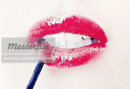 Close up of womans lips with lip gloss