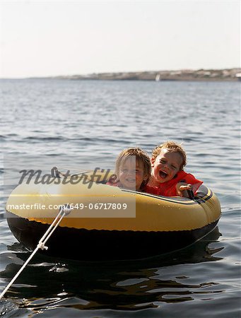 Children riding in inflatable boat