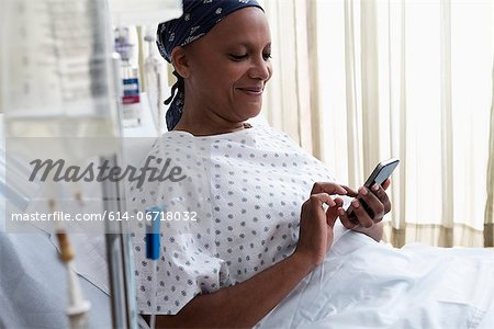 Female hospital patient using cellphone