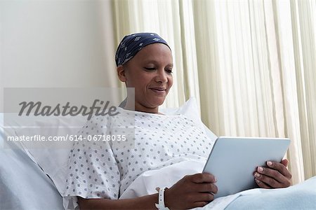 Female hospital patient using digital tablet