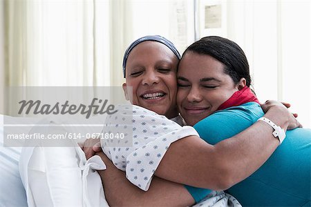 Daughter hugging mother at hospital