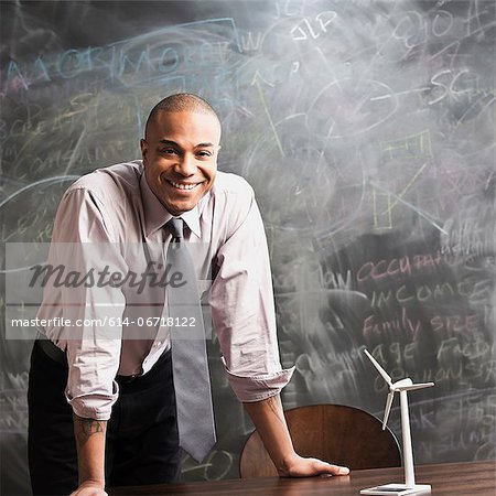 Man with model wind turbine