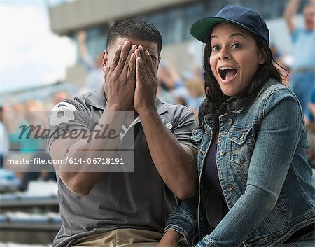 Couple caught on camera at sports game