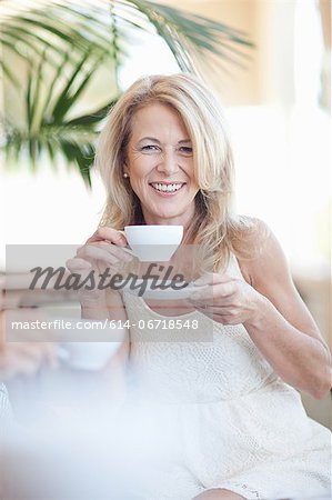 Older woman having cup of coffee