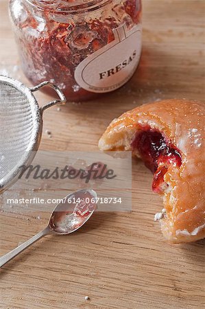 Doughnuts and jam on table Doughnuts and jam on table