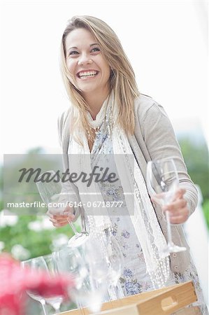 Woman setting table outdoors