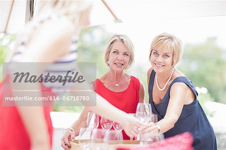 Women setting table outdoors