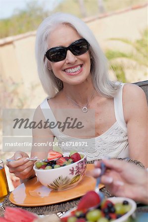 Older woman having lunch outdoors
