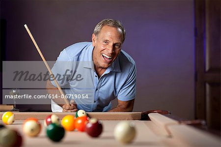 Older man playing pool