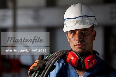 Industrial worker with wires in plant