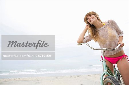 Woman on bicycle on beach