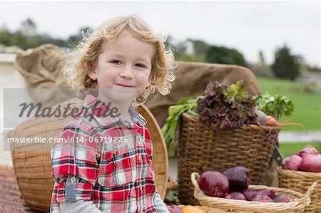 Boy with produce in truck bed