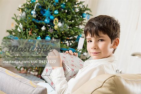 Boy opening Christmas gift