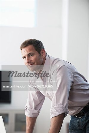 Businessman standing at desk