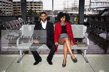 Couple on bench at train station