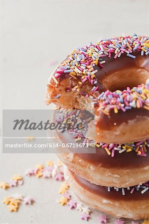 Stack of doughnuts with bite