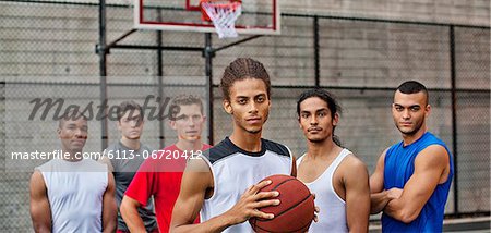 Men standing on basketball court