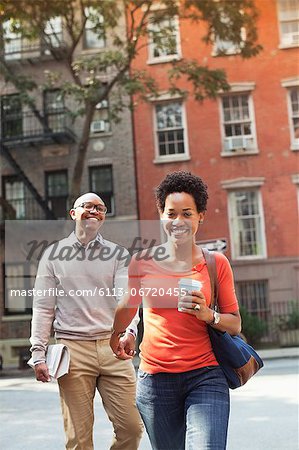 Couple walking together on city street