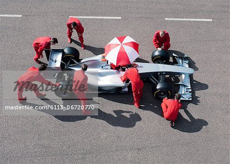 Racing team working at pit stop