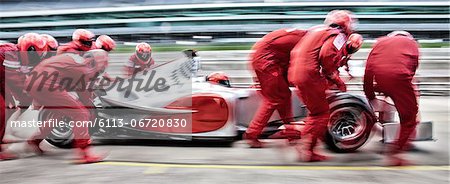 Racing team working at pit stop