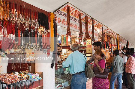 Tourists buying merchandise from souvenir shop, Chandi Temple, Haridwar, Uttarakhand, India