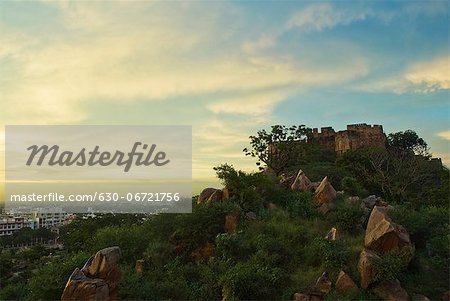 Fort with cityscape at dusk, Amber, Amber Fort, Jaipur, Rajasthan, India