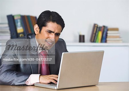 Businessman working on a laptop in an office