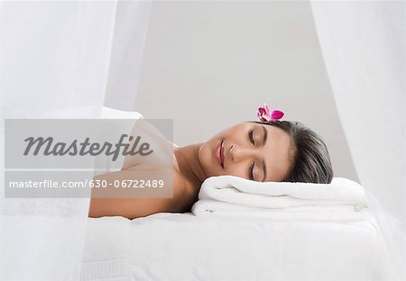 Woman receiving spa treatment with her eyes closed
