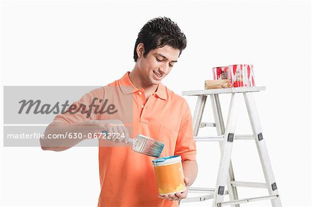 Man holding a paint can