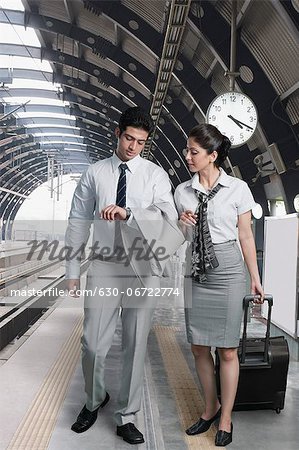 Business couple at a subway station