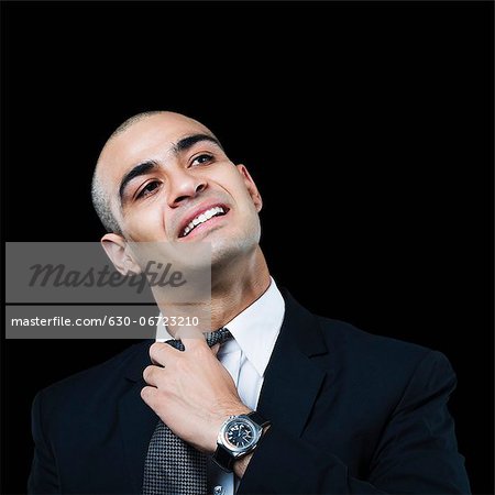 Businessman loosening his tie