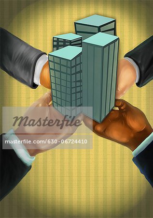 Business people's hands holding office buildings