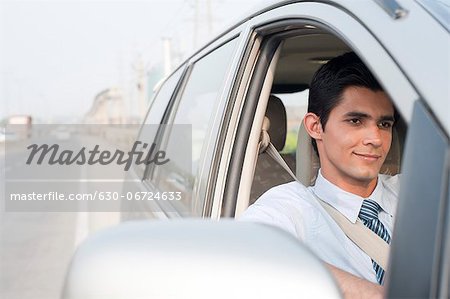 Businessman driving a car, Gurgaon, Haryana, India