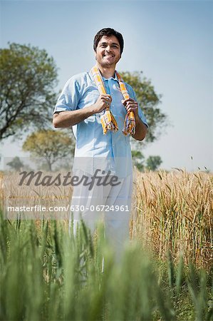 Farmer standing in the field, Sohna, Haryana, India